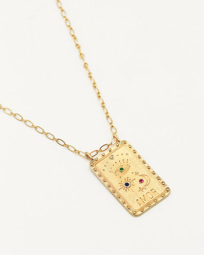 collier plaque avec inscriptions amor, lune, soleil et oeil